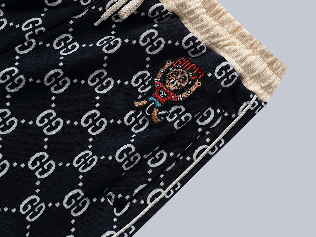 Gucci GG Monogram Jogger Pants with Embroidered Crest