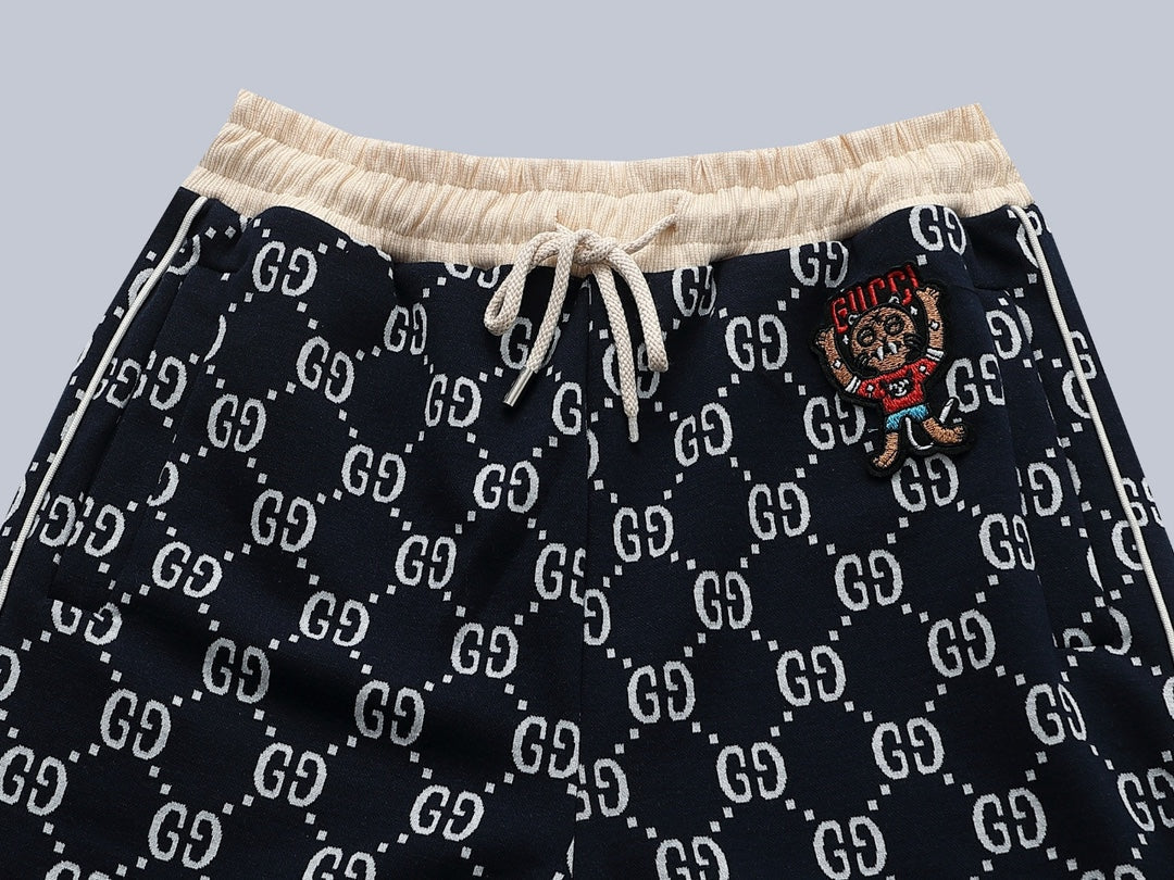 Gucci GG Monogram Jogger Pants with Embroidered Crest