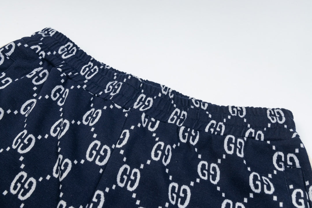 Gucci GG Monogram Jogger Pants – Navy Blue with Web Stripe